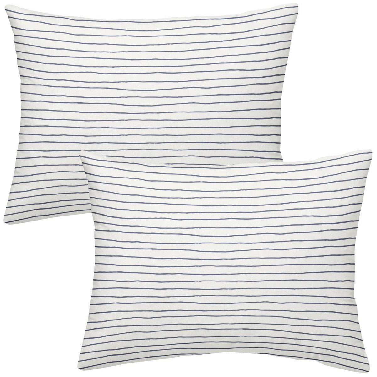 Makemake Organics toddler pillowcase navy stripes closeup with breathable cotton sateen texture.