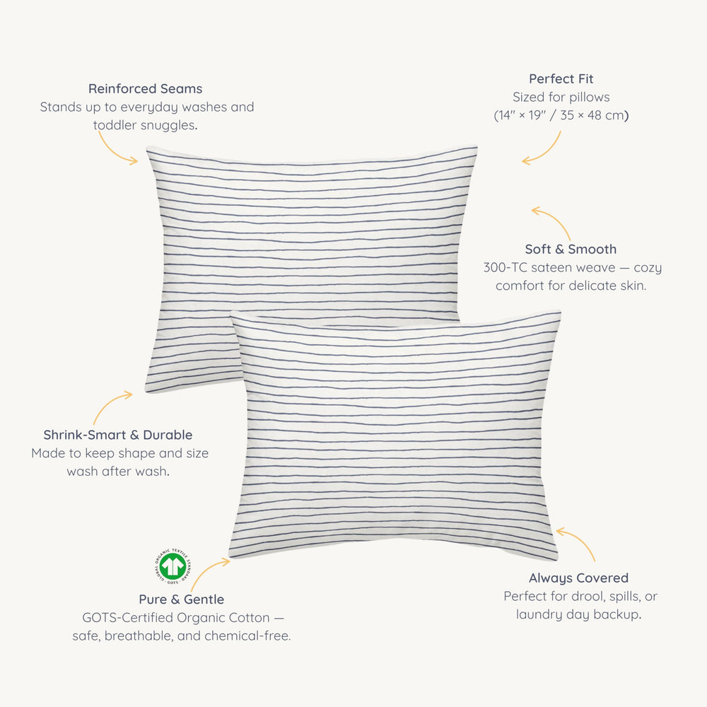 Makemake Organics toddler pillowcase navy stripes shown in reusable gift bag packaging.