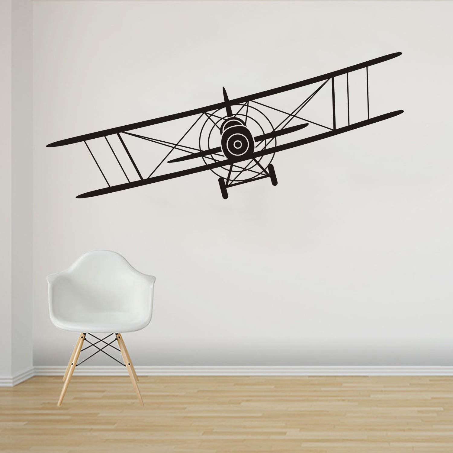 Makeyes Biplane wall decal on a bedroom wall adds aviation charm.