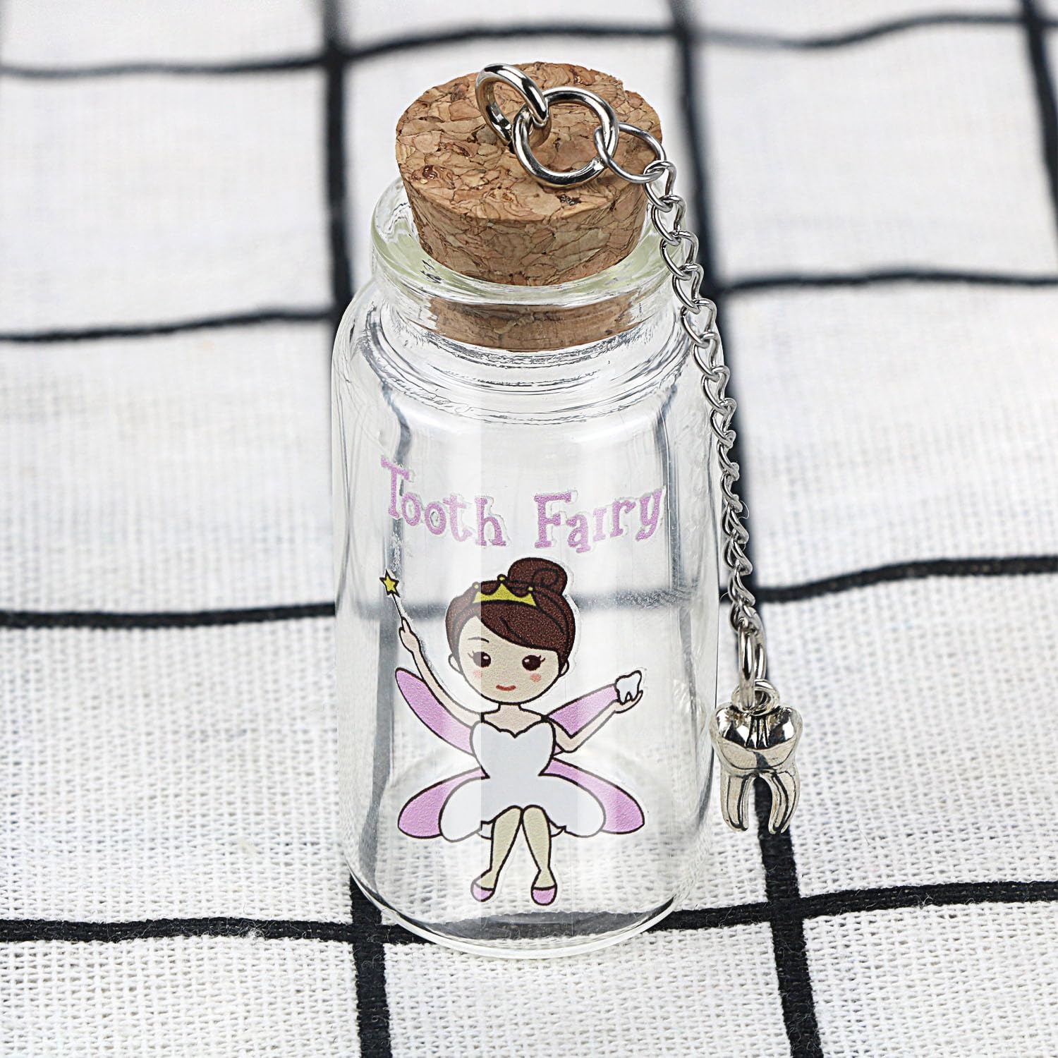 Malihome keepsake jar with cork stores a baby tooth securely