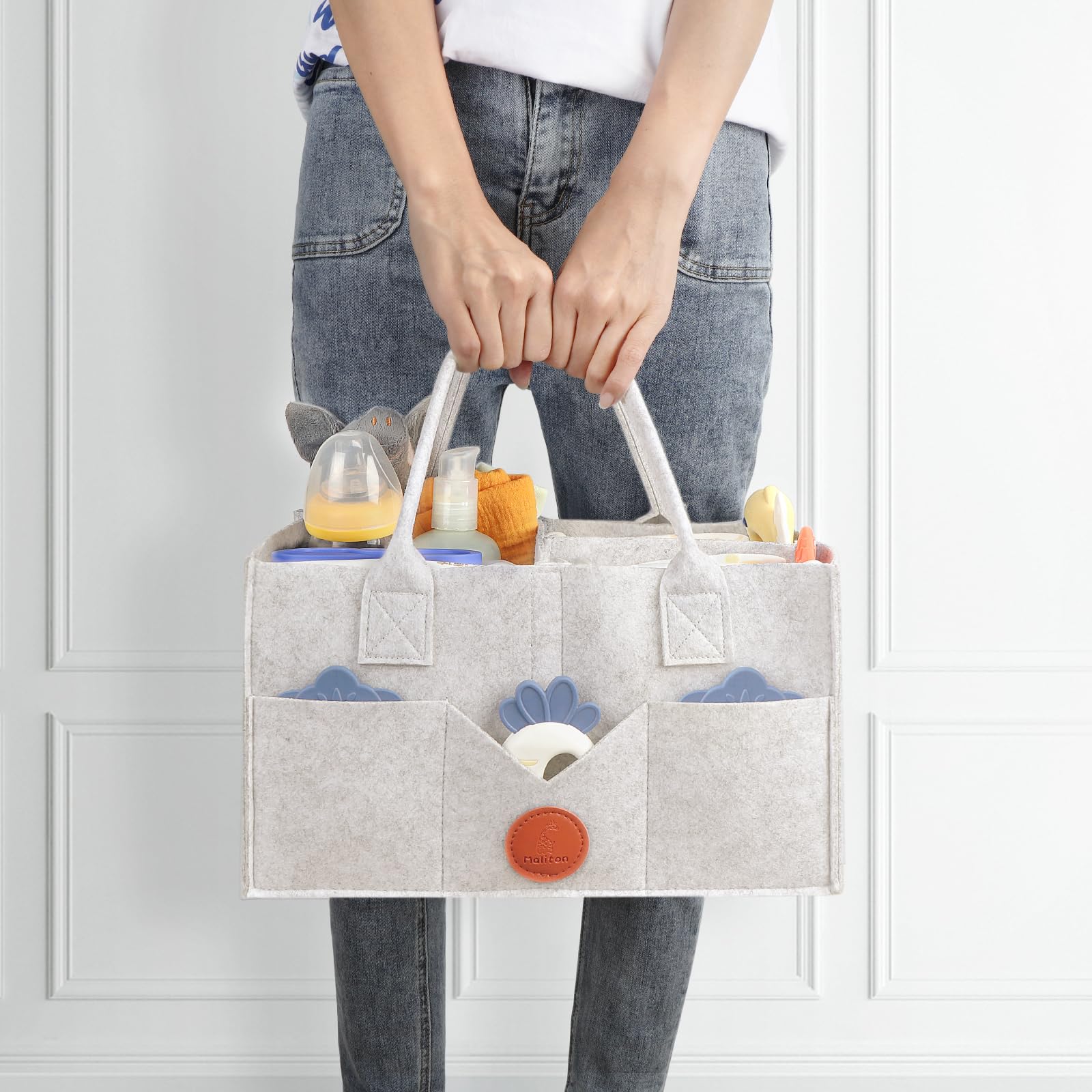 Maliton diaper caddy showing eight exterior pockets for quick access