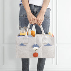 Maliton diaper caddy showing eight exterior pockets for quick access