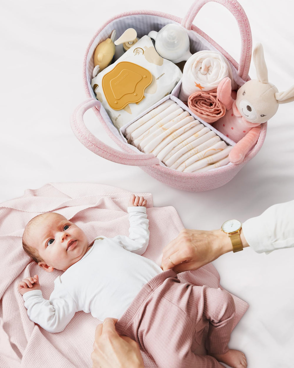 Maliton diaper caddy easily moves with longer handles between nursery, bathroom, and car