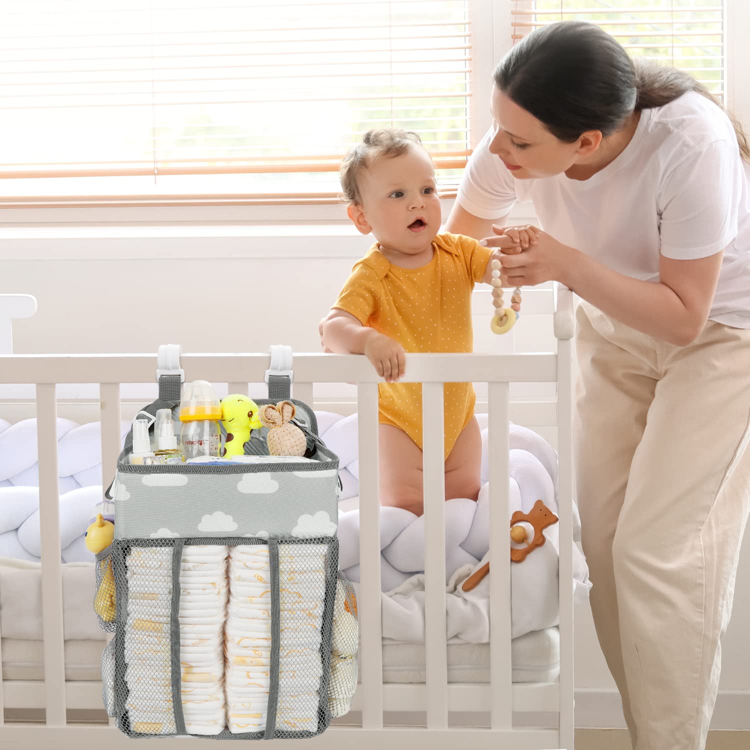 Two adjustable straps on Maliton diaper caddy for versatile mounting on crib or playard