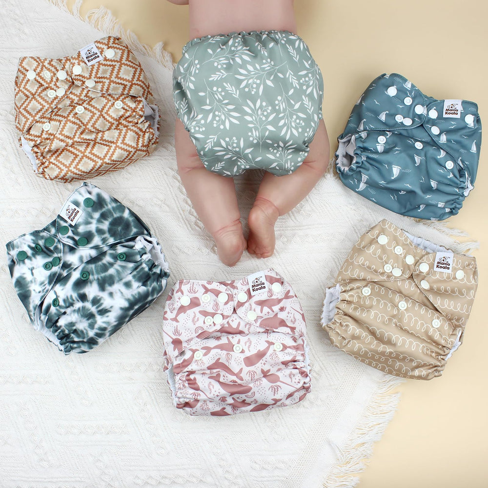 Mama Koala 3.0 pocket diaper hip snaps for snug, adjustable positioning.