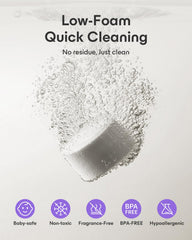 Tablet dissolving in water demonstrates enzyme action for bottle cleanliness.