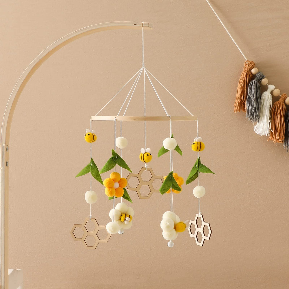 Natural felt balls and wooden beads provide tactile textures for safe exploration
