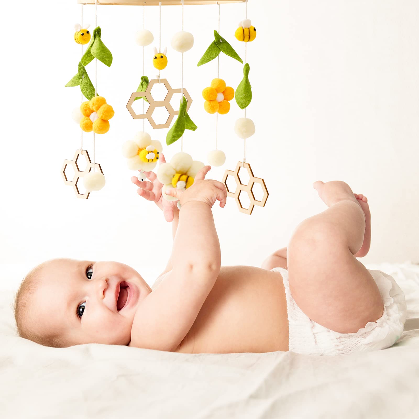 Bee Bedbell in white, green, and yellow design adds warm, natural vibes to the nursery
