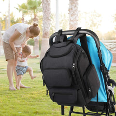 Mancro diaper bag backpack showing multiple pockets for quick access and organized items