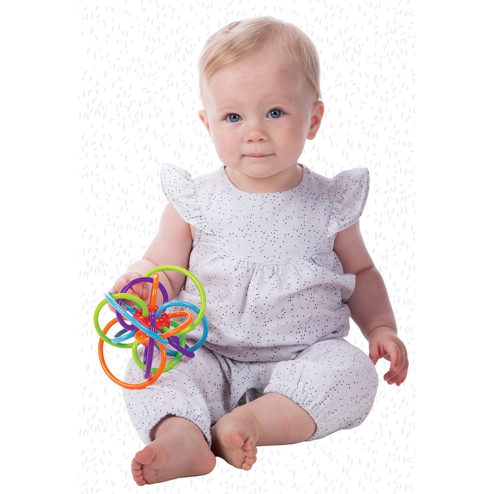 Center cube rattle of Winkel demonstrates gentle cause-and-effect sound.