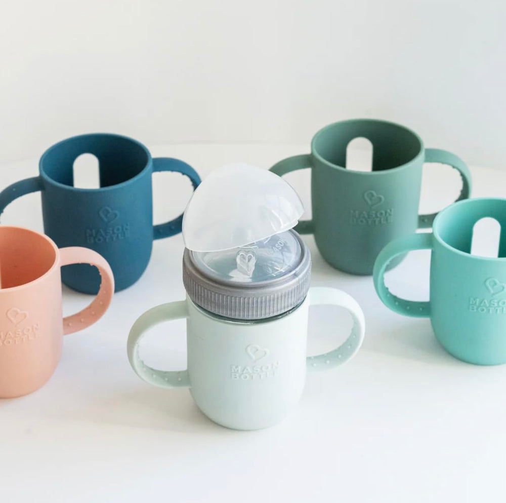 Mason Bottle silicone sleeve protects glass from drops during meals.