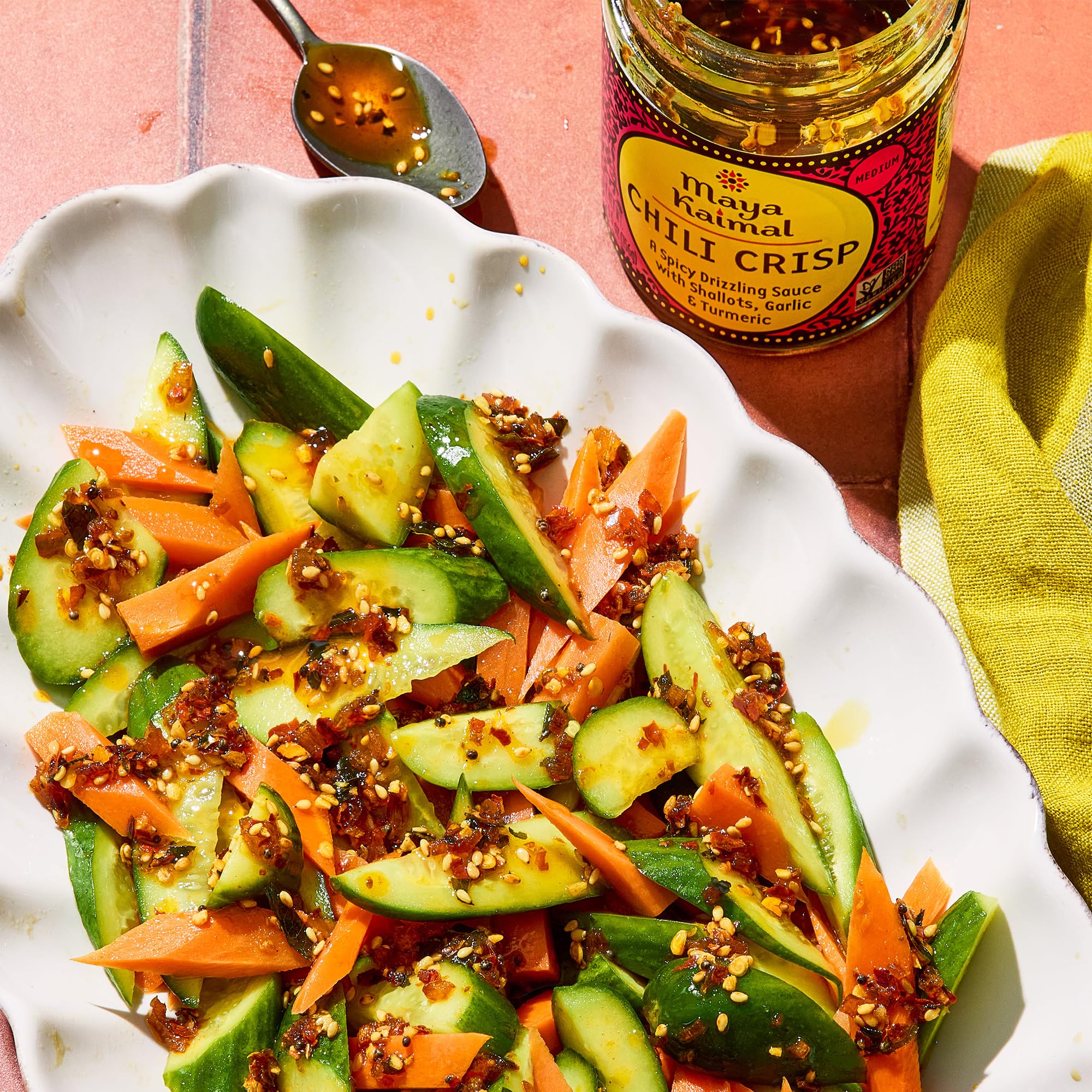 Maya Kaimal Chili Crisp with hummus and veggies for dipping.