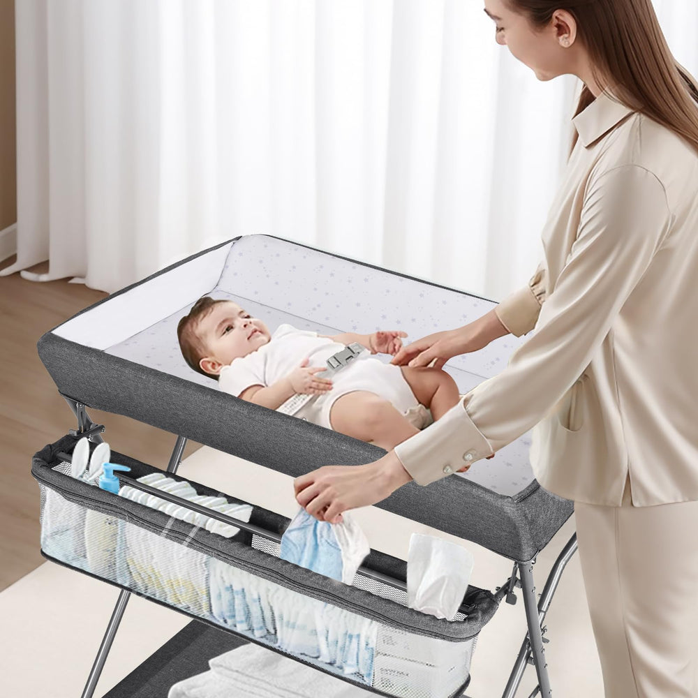Maydolly portable adjustable-height folding diaper station supports different caregiver heights.