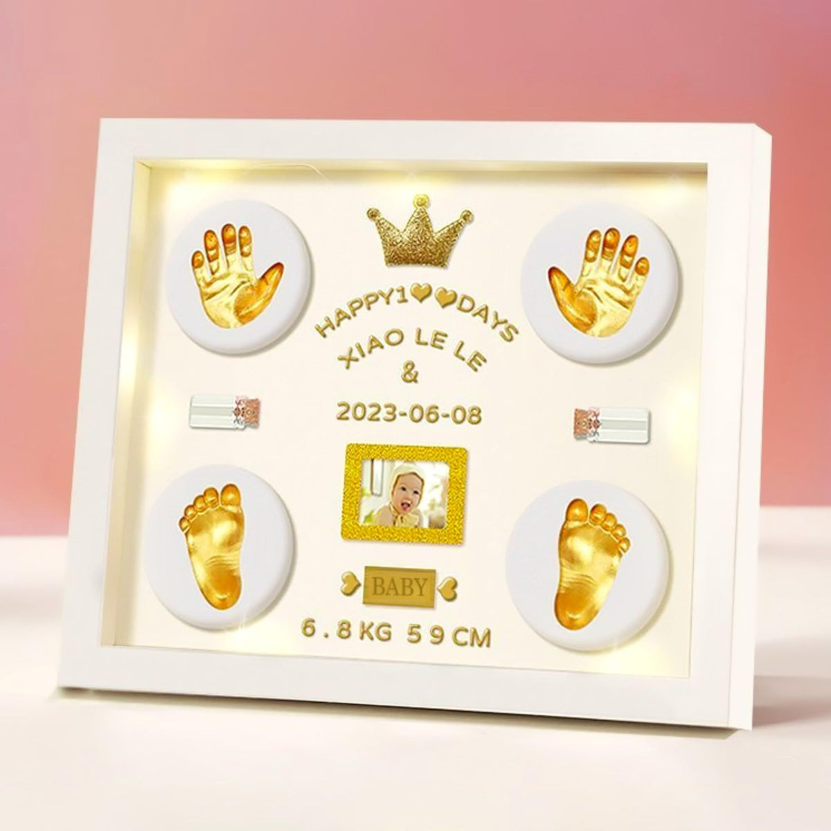 MCstars Baby Handprint Frame with gold lettering on a modern white design for nursery display