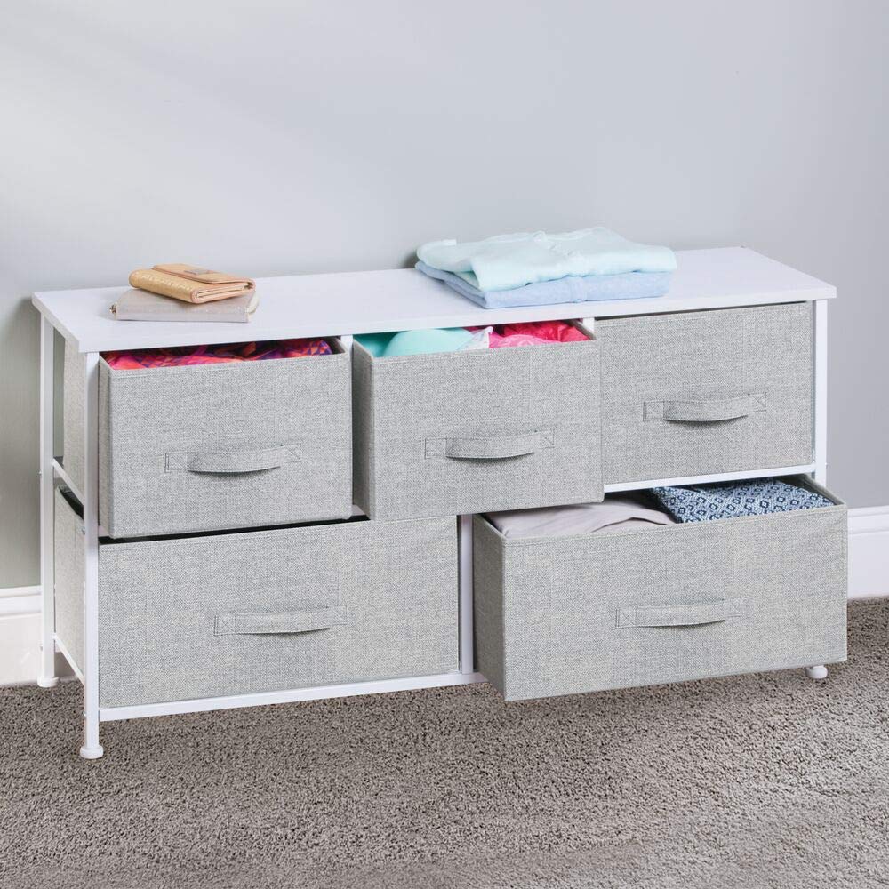 mdesign five-drawer gray and white unit keeps clothes neatly organized.