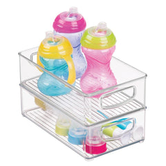 mDesign Ligne clear bin on a shelf supports tidy diapering and feeding supplies.