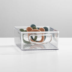 mDesign Ligne clear bin with side handles enables portable storage of bottles and formulas.