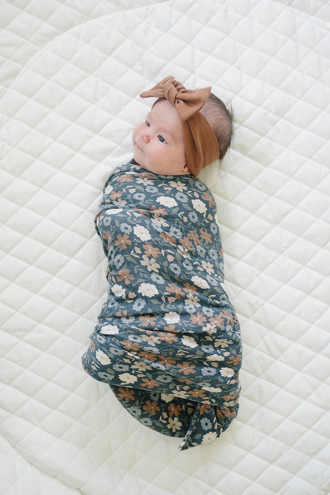 Mebie Baby 47x47 inch swaddle demonstrates generous size for versatile wrapping