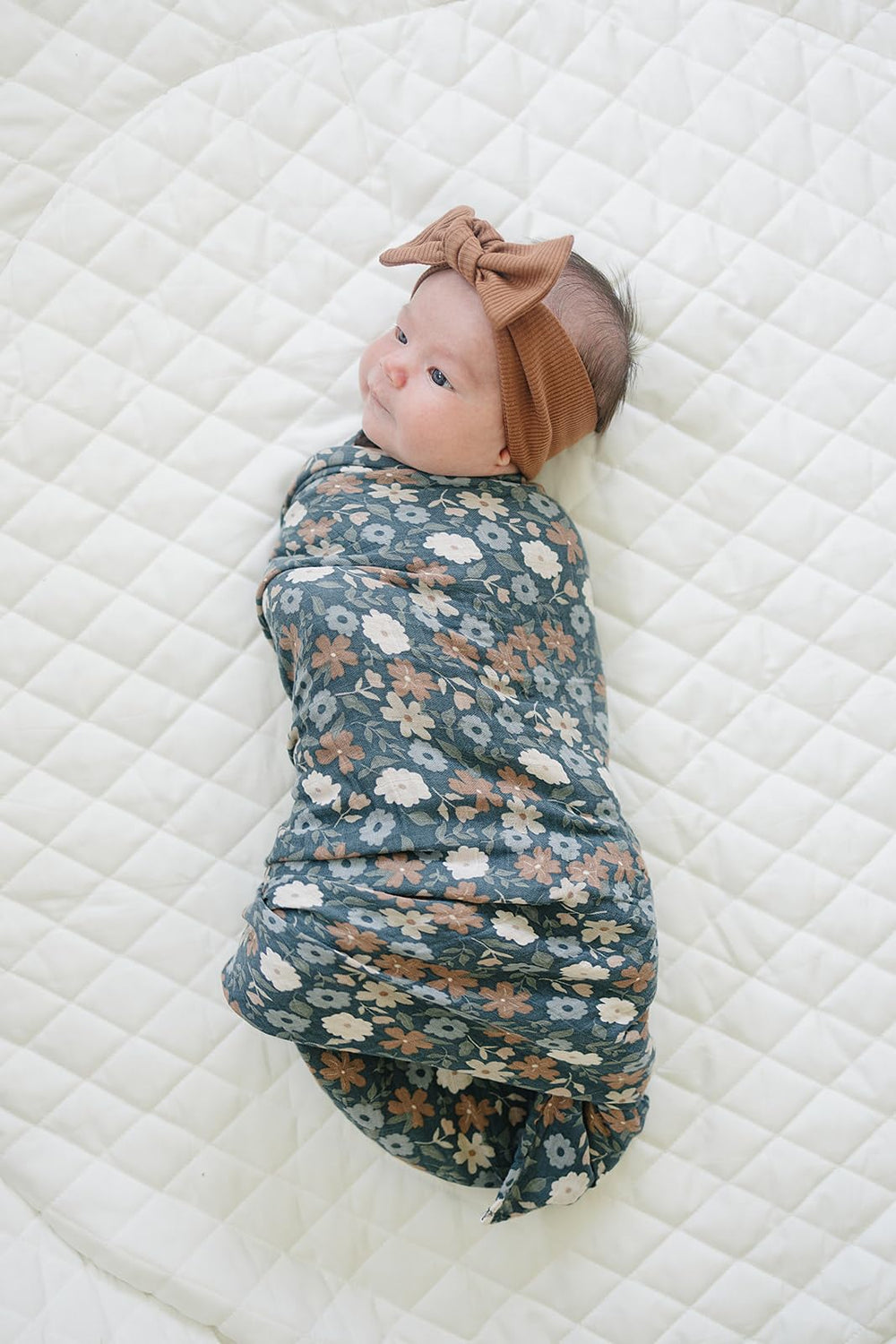 Mebie Baby 47x47 inch swaddle demonstrates generous size for versatile wrapping
