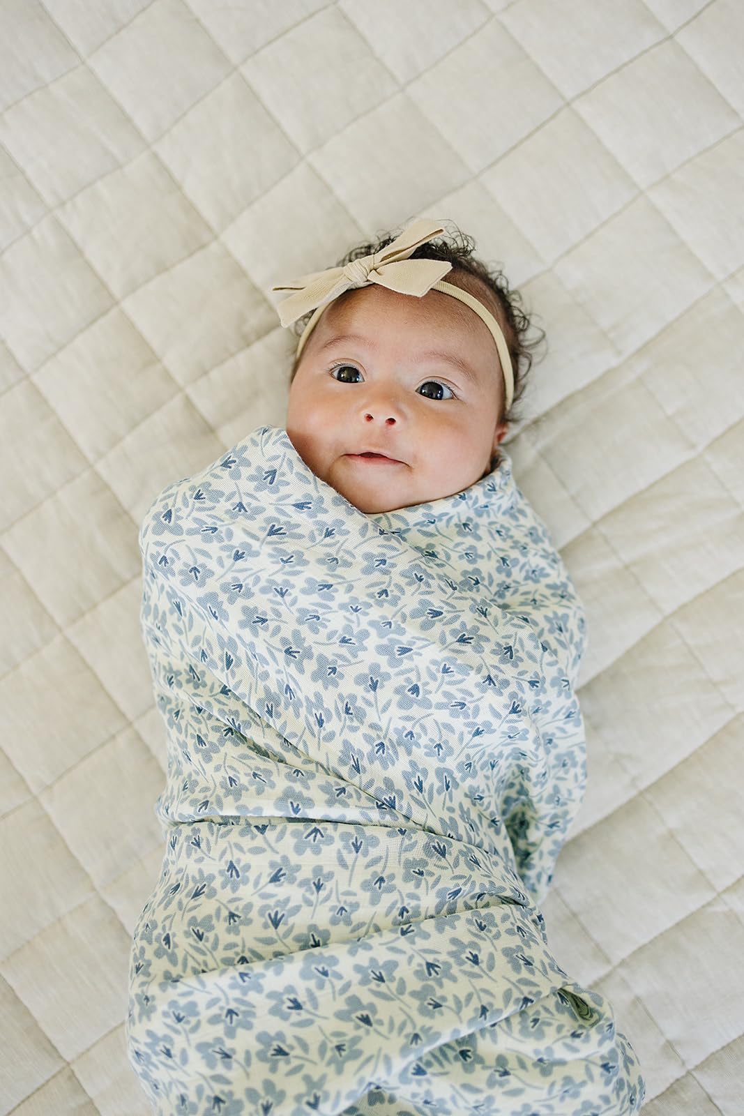 Mebie Baby Blue Blossom swaddle close-up showing soft, gentle fabric
