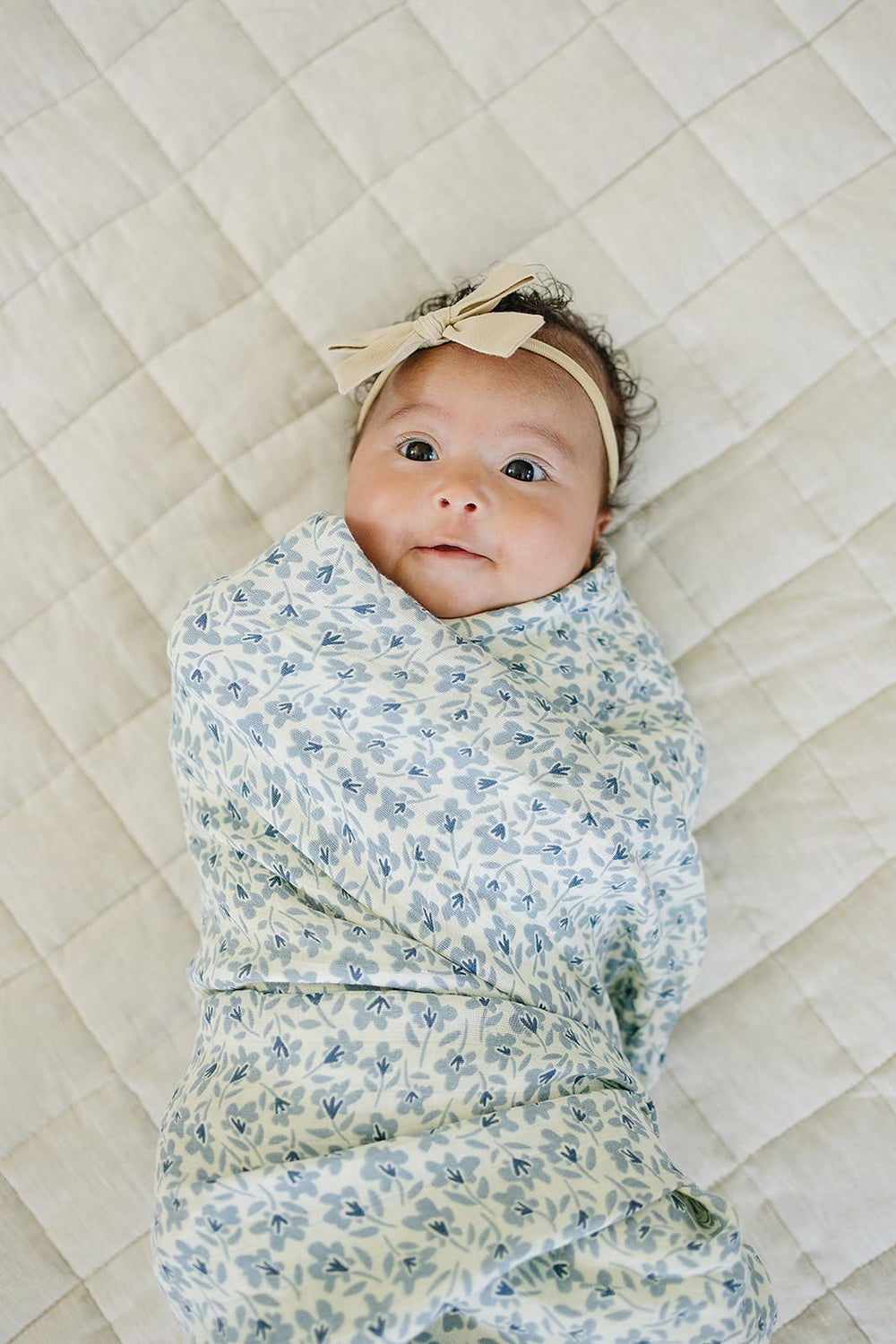 Mebie Baby Blue Blossom swaddle close-up showing soft, gentle fabric