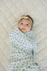 Mebie Baby Blue Blossom swaddle close-up showing soft, gentle fabric