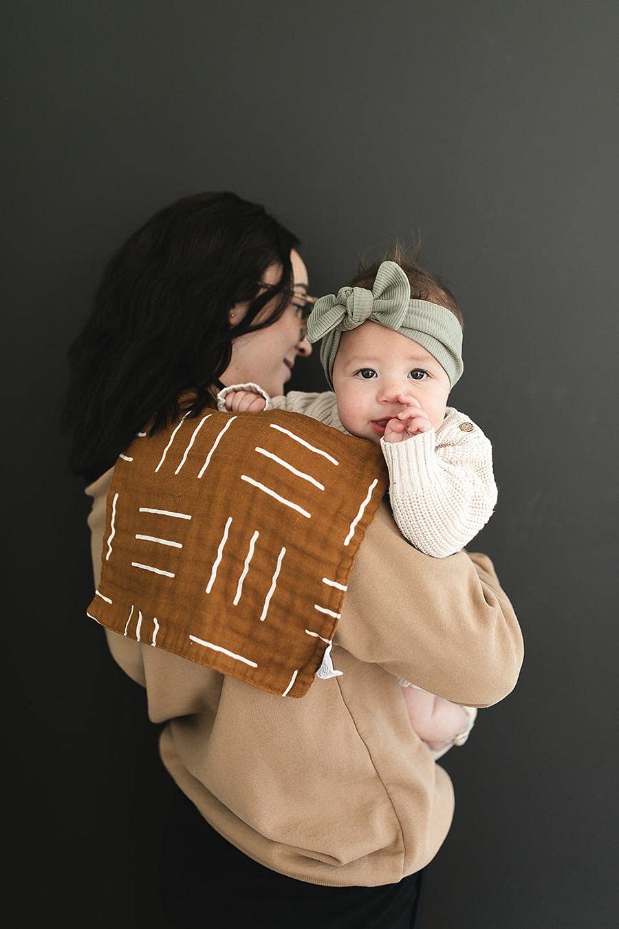 Mebie Baby Burp Cloths during drool moments; absorbent fabric and gentle texture.
