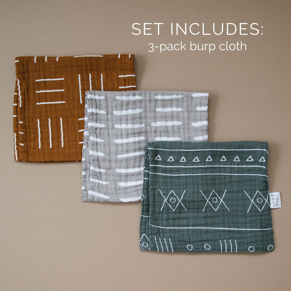 Mebie Baby Burp Cloths folded in a diaper bag; convenient multi-use on the go.