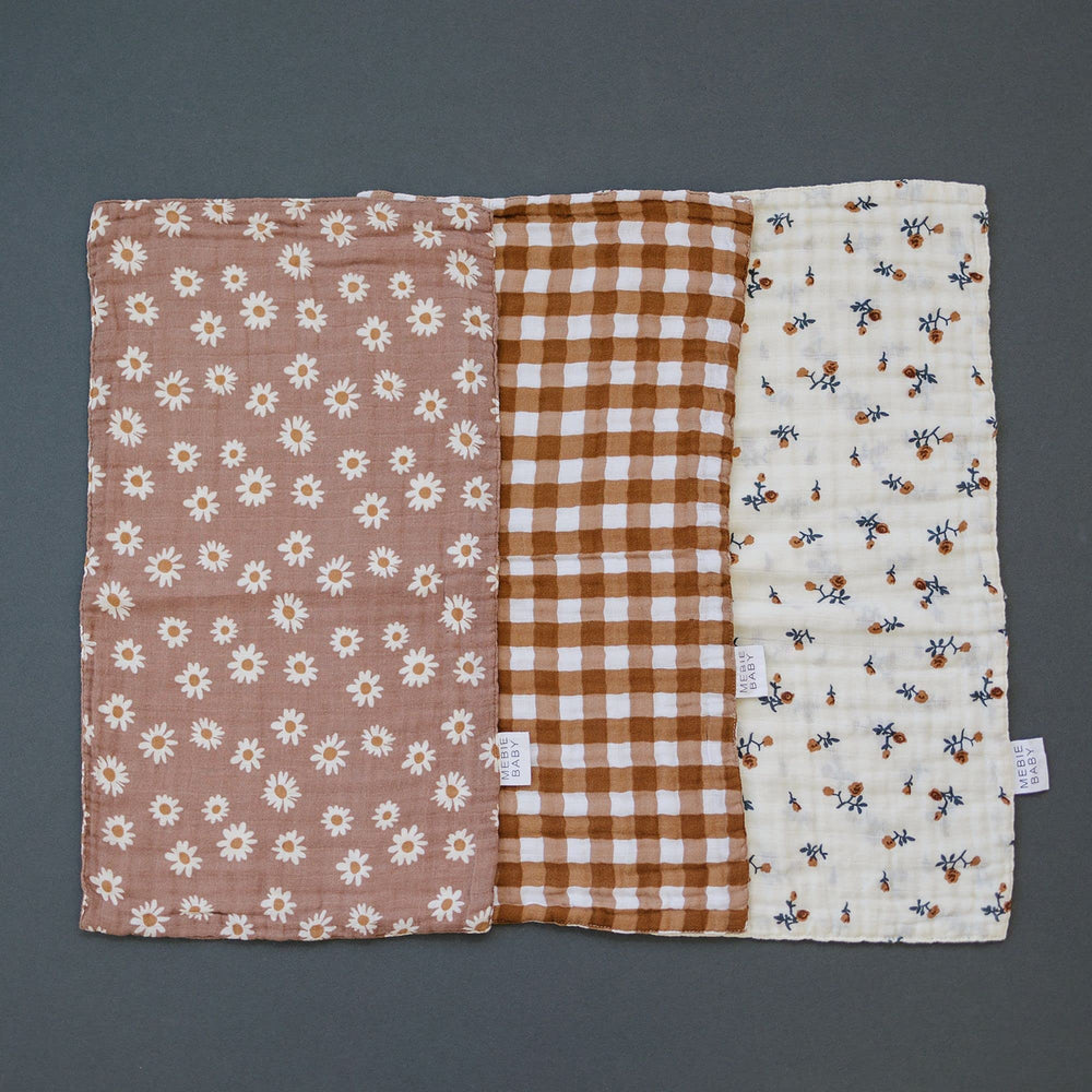 Mebie Baby burp cloths close-up on soft muslin for gentle touch.