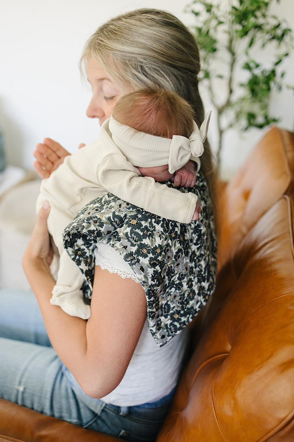 Mebie Baby burp cloths show soft muslin texture against baby skin.