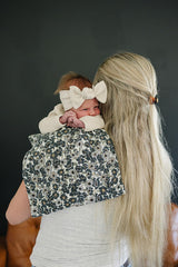 Mebie Baby burp cloths in assorted colors to match nursery decor.