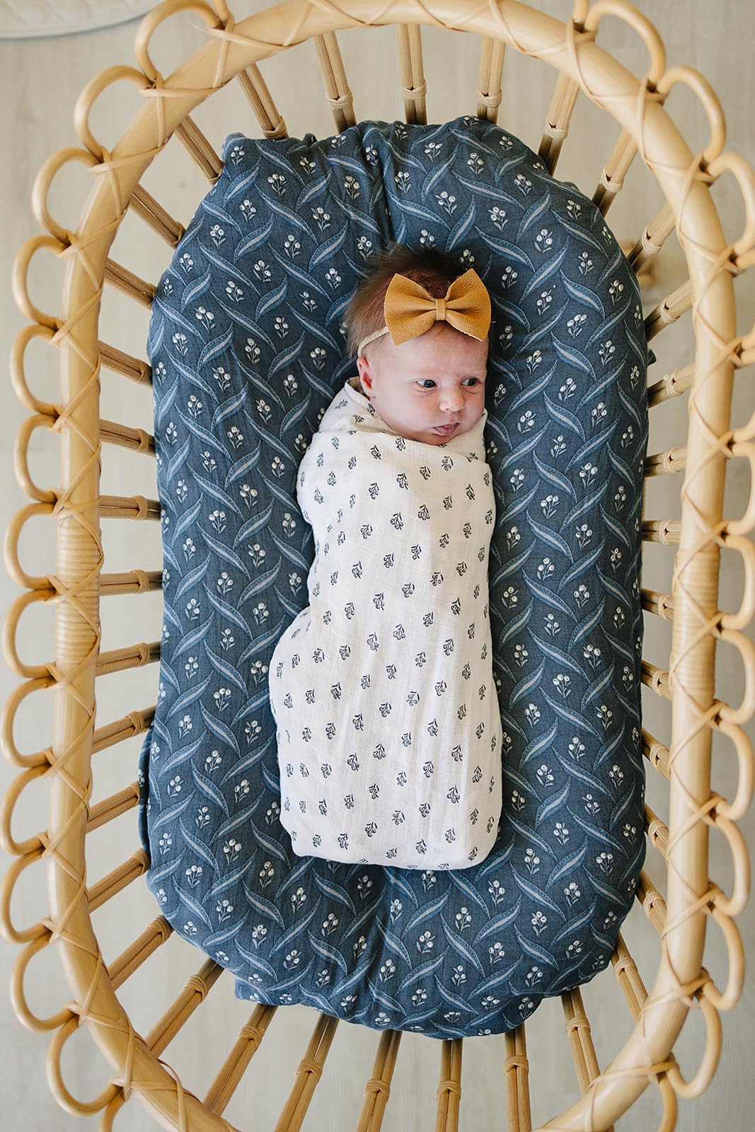 Mebie Baby Cream Berry swaddle close-up highlights breathable cotton fabric