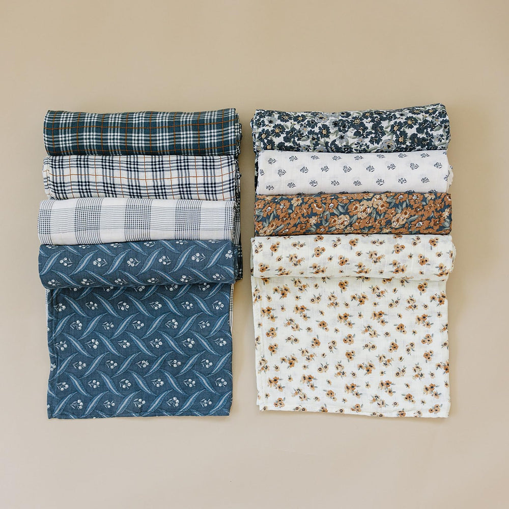 Mebie Baby Liberty Floral Muslin Swaddle shown folded for portable softness.
