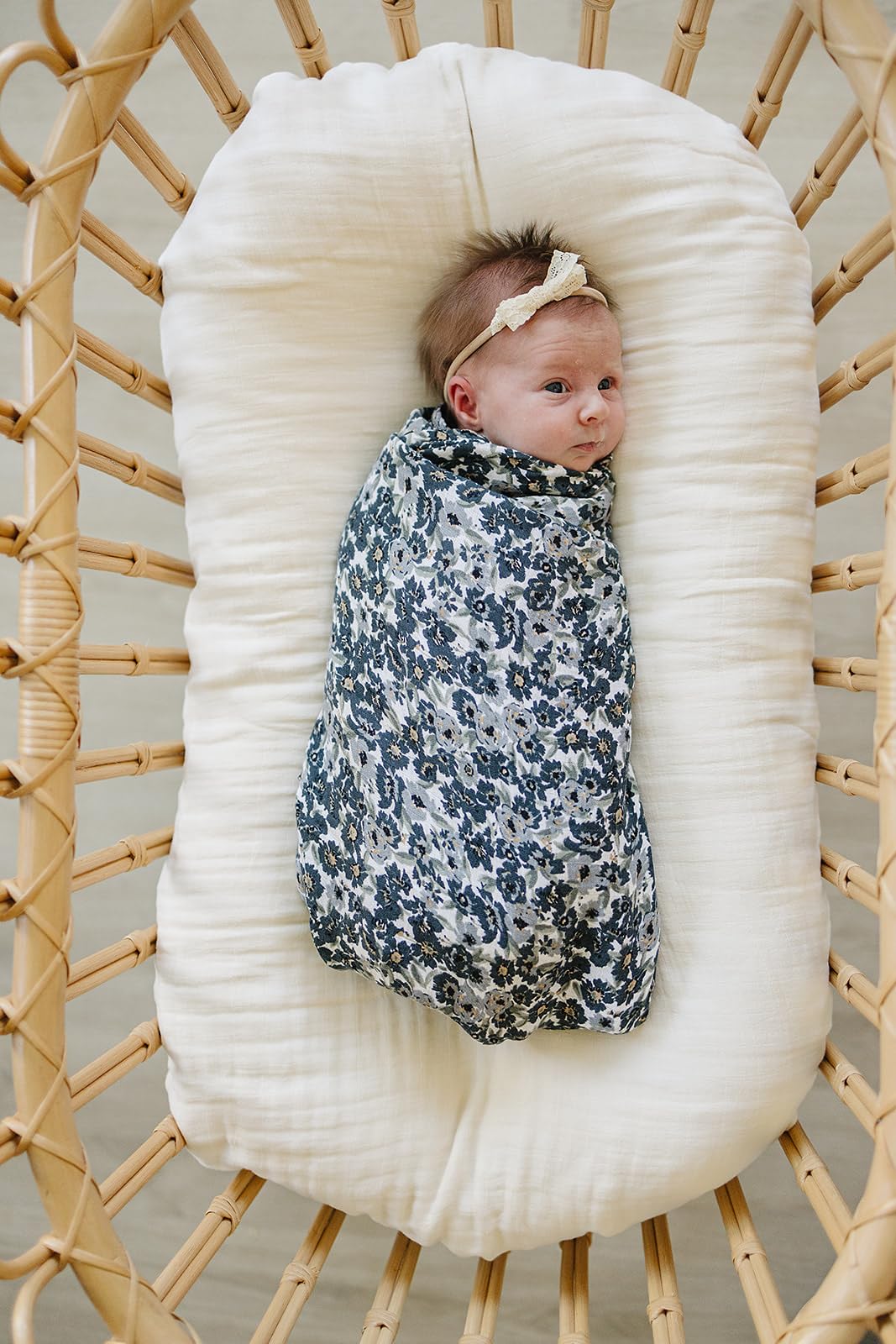 Mebie Baby Liberty Floral Muslin Swaddle used as lightweight blanket in stroller.