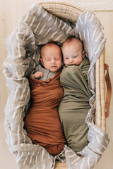 Mebie Baby machine-washable swaddle ensures easy cleaning for busy caregivers.