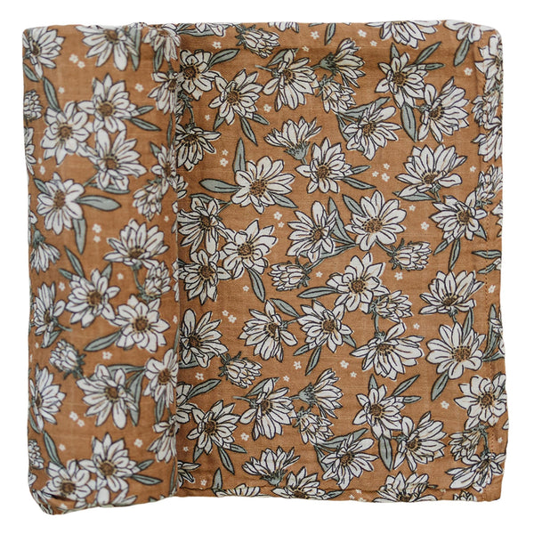 Mebie Baby Magnolia Muslin Swaddle blanket laid flat, soft and breathable.
