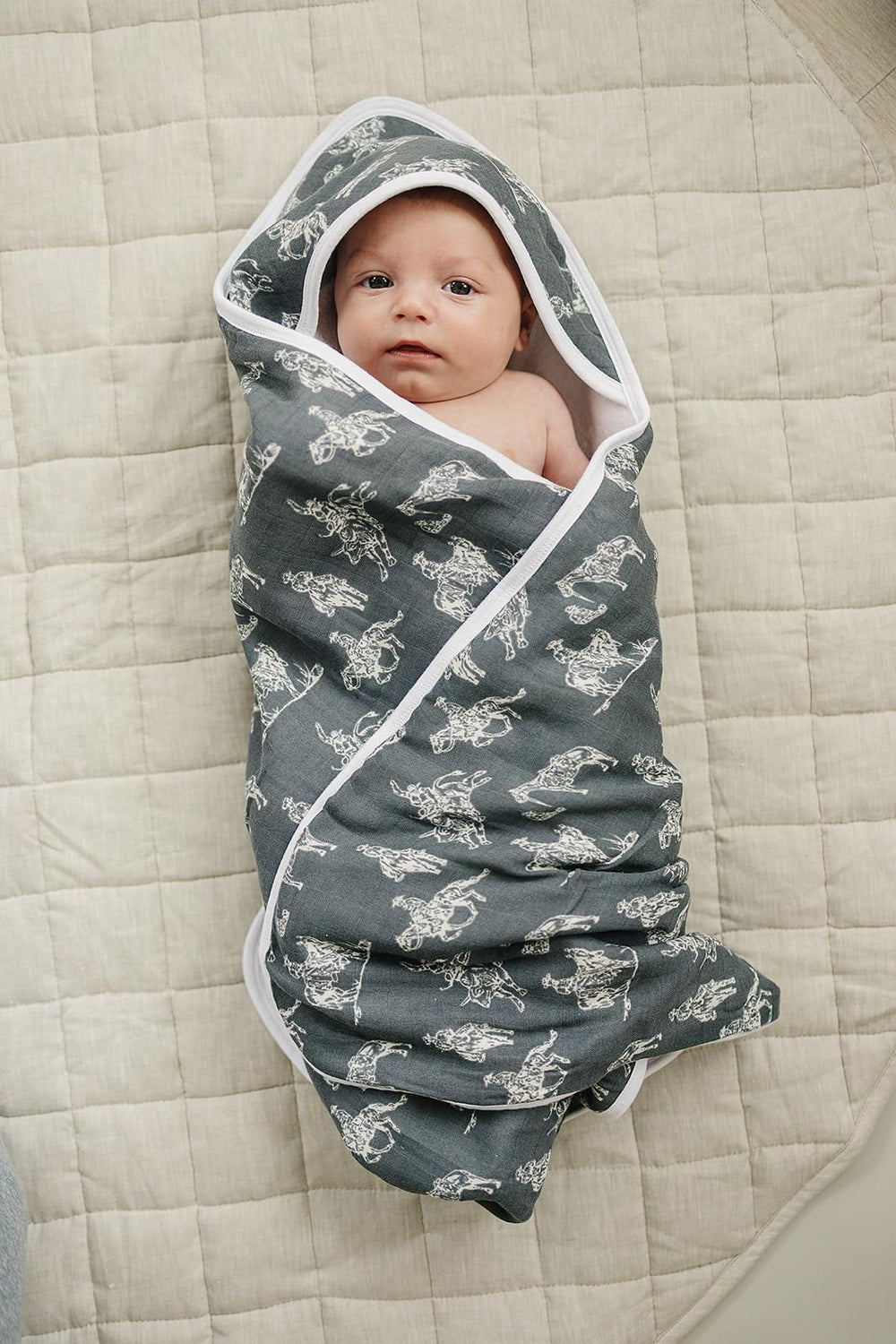 Bathroom scene with colorful Mebie Baby hooded towel for boy or girl