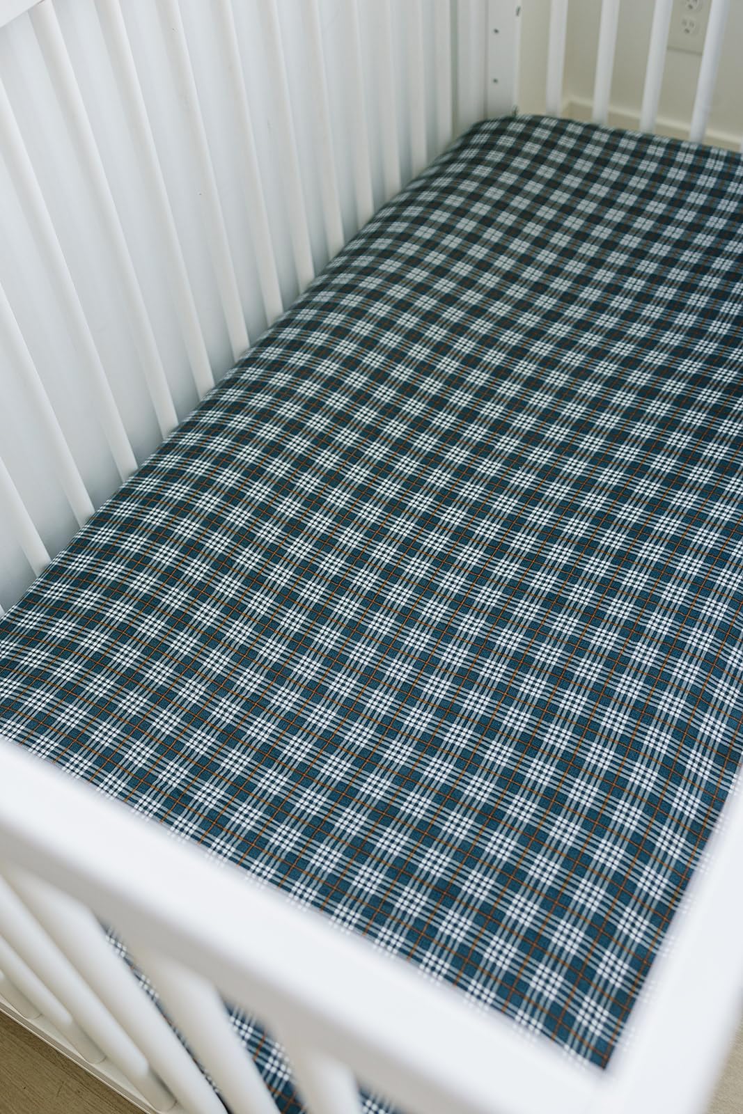 Mebie Baby navy plaid muslin sheet on standard crib mattress, easy to fit and coordinate in modern nurseries