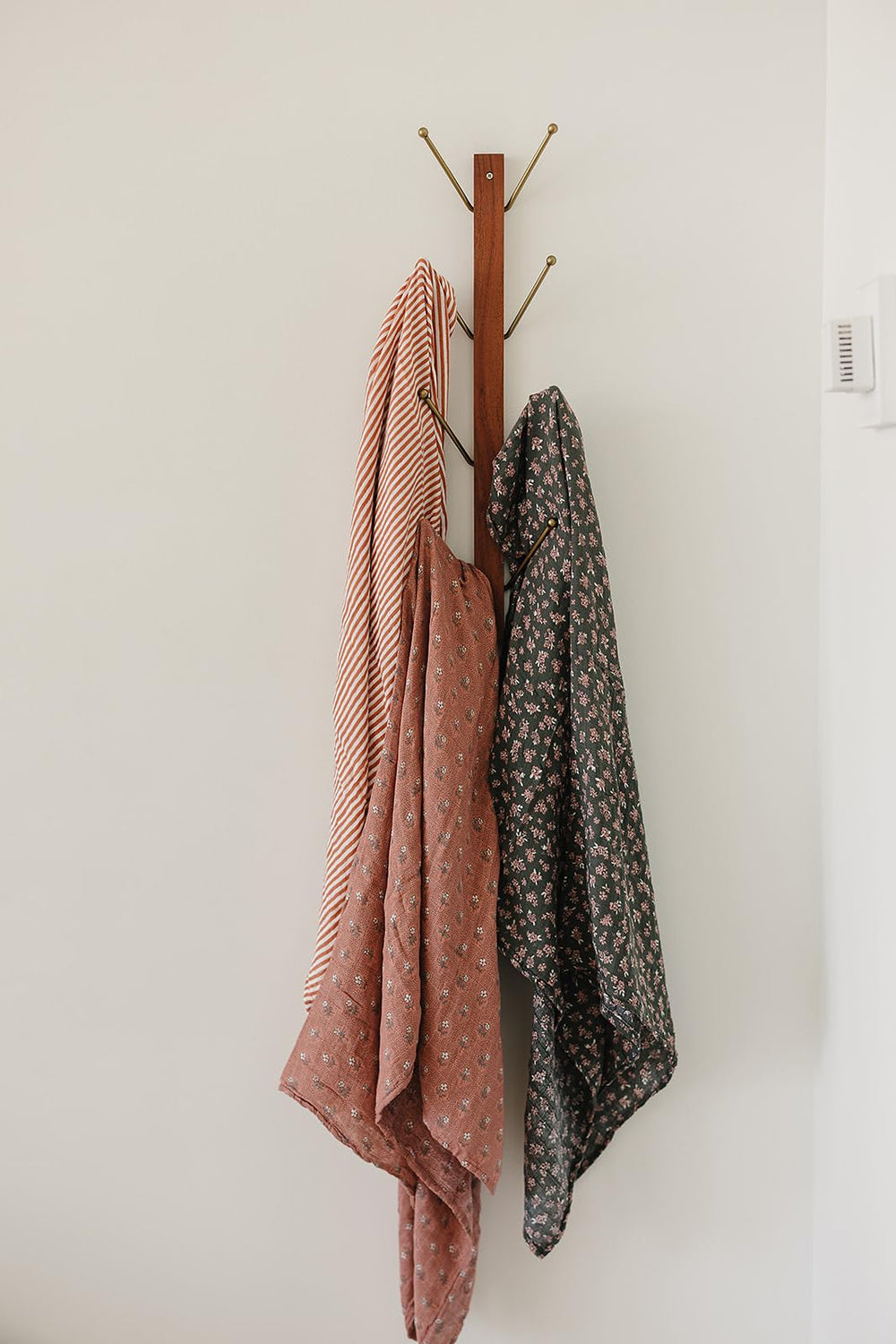 Mebie Baby Olive Bloom swaddle folded highlights lightweight blanket versatility for everyday use.