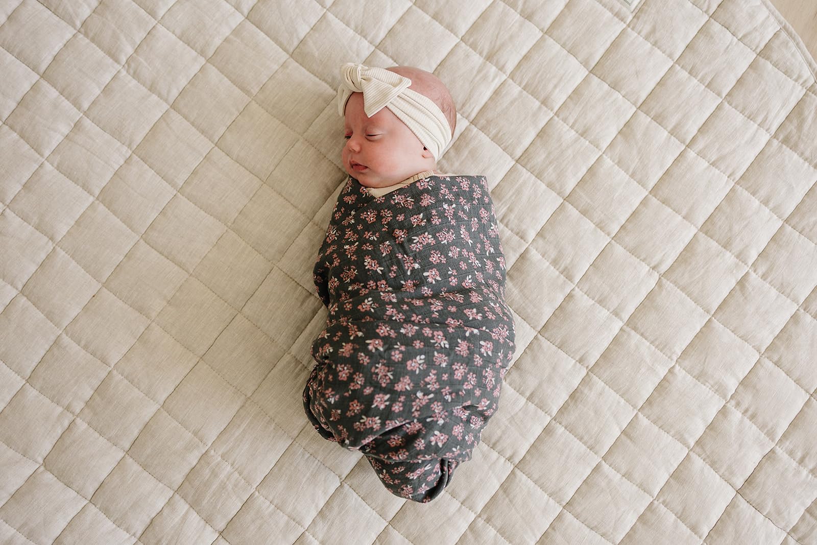 Mebie Baby Olive Bloom swaddle spread showcases modern neutral design and spacious 47 by 47 inches.