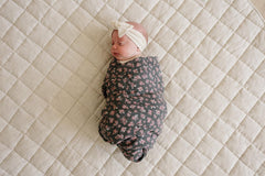 Mebie Baby Olive Bloom swaddle spread showcases modern neutral design and spacious 47 by 47 inches.