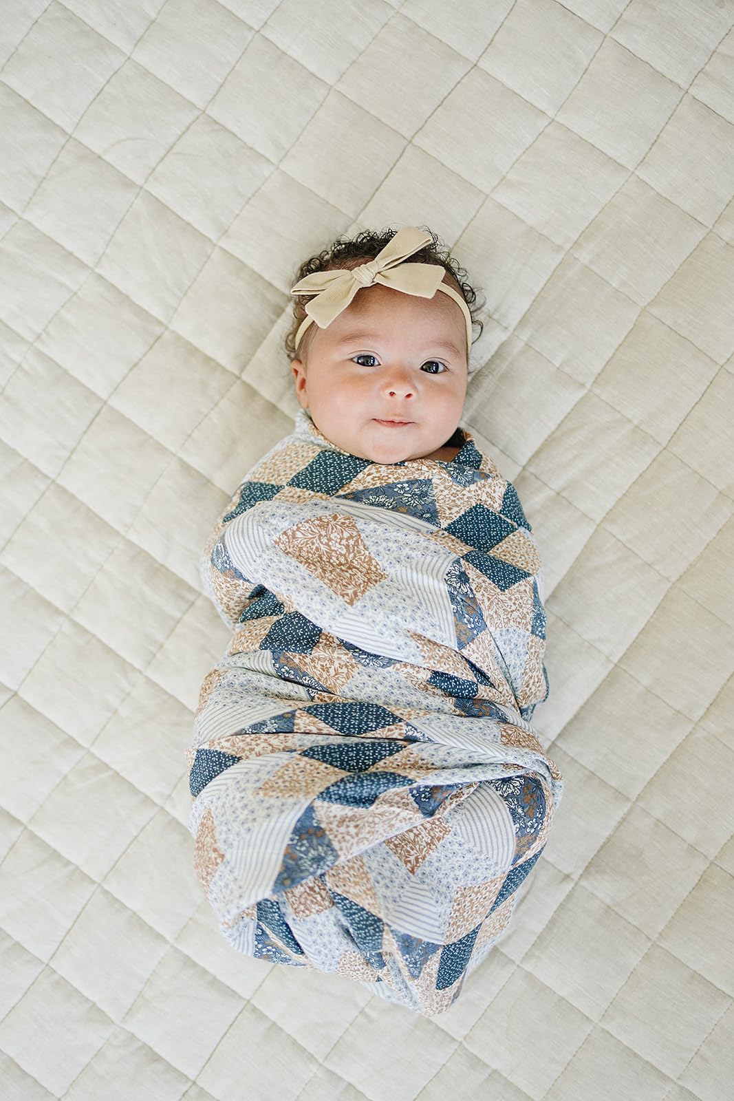 Mebie Baby Patchwork Swaddle on baby demonstrates versatile wrap for naps