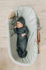 Mebie Baby Sage stretch swaddle demonstrates ample 47x47 inch size for cozy wraps