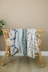 Versatile Mebie Baby swaddle used as a light blanket.