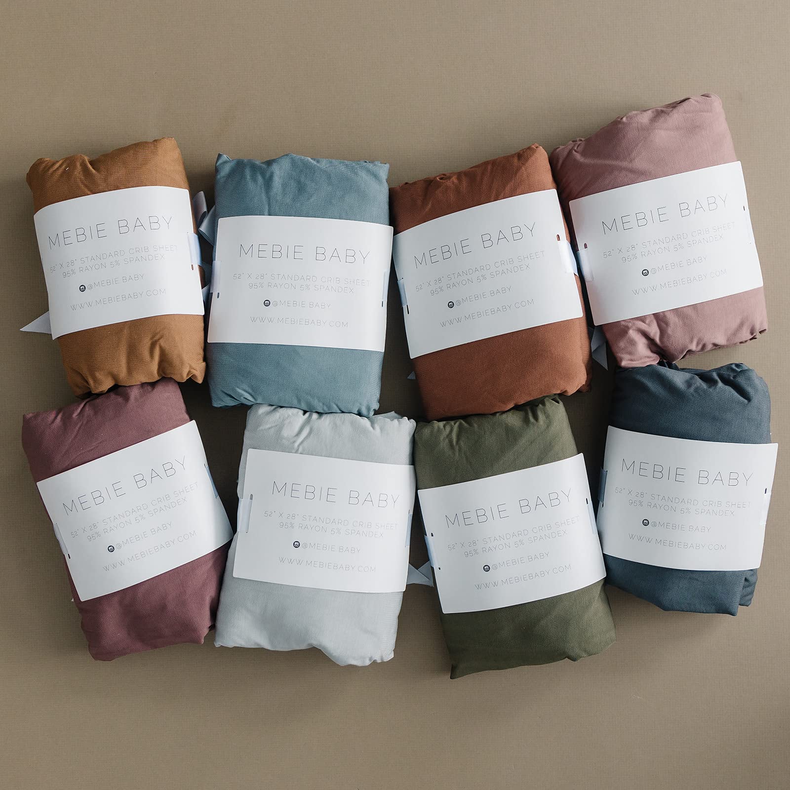 Mebie Baby stretch sheet rust on nursery decor shows easy-coordination.
