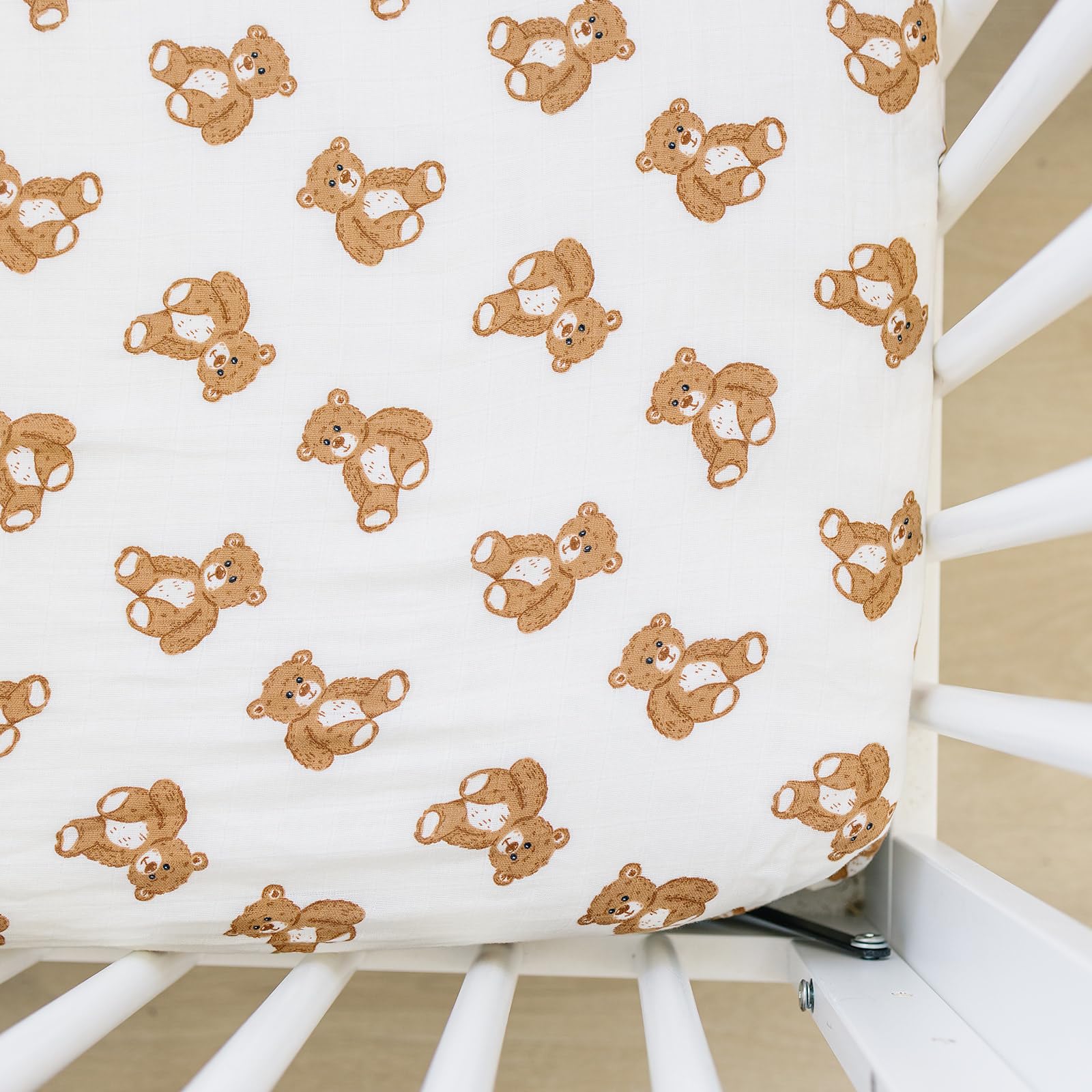 Mebie Baby Teddy Bear Muslin Sheet close-up shows soft, breathable fabric for naps.