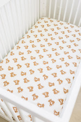 Mebie Baby Teddy Bear Muslin Sheet on a standard crib mattress for a snug fit.