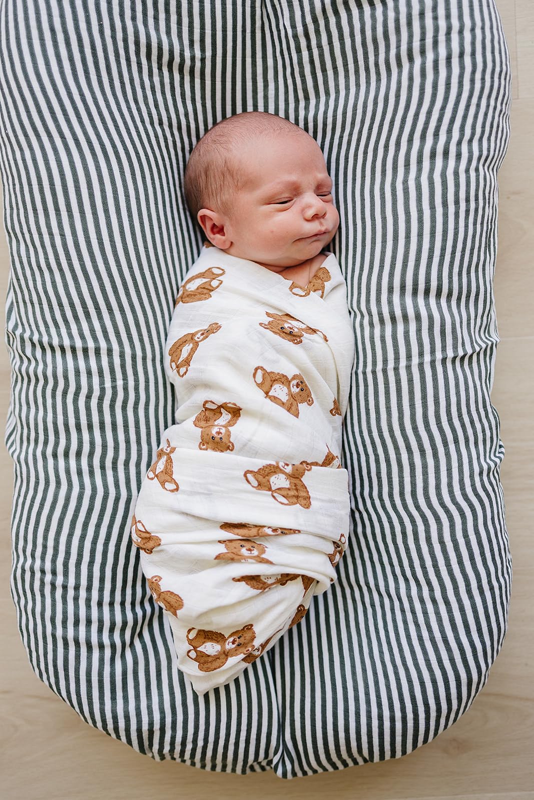 Mebie Baby Teddy Bear Muslin Swaddle pattern highlights a neutral design for nursery decor.