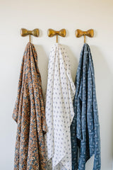 Mebie Baby Venetian Floral Swaddle in a modern nursery setting.