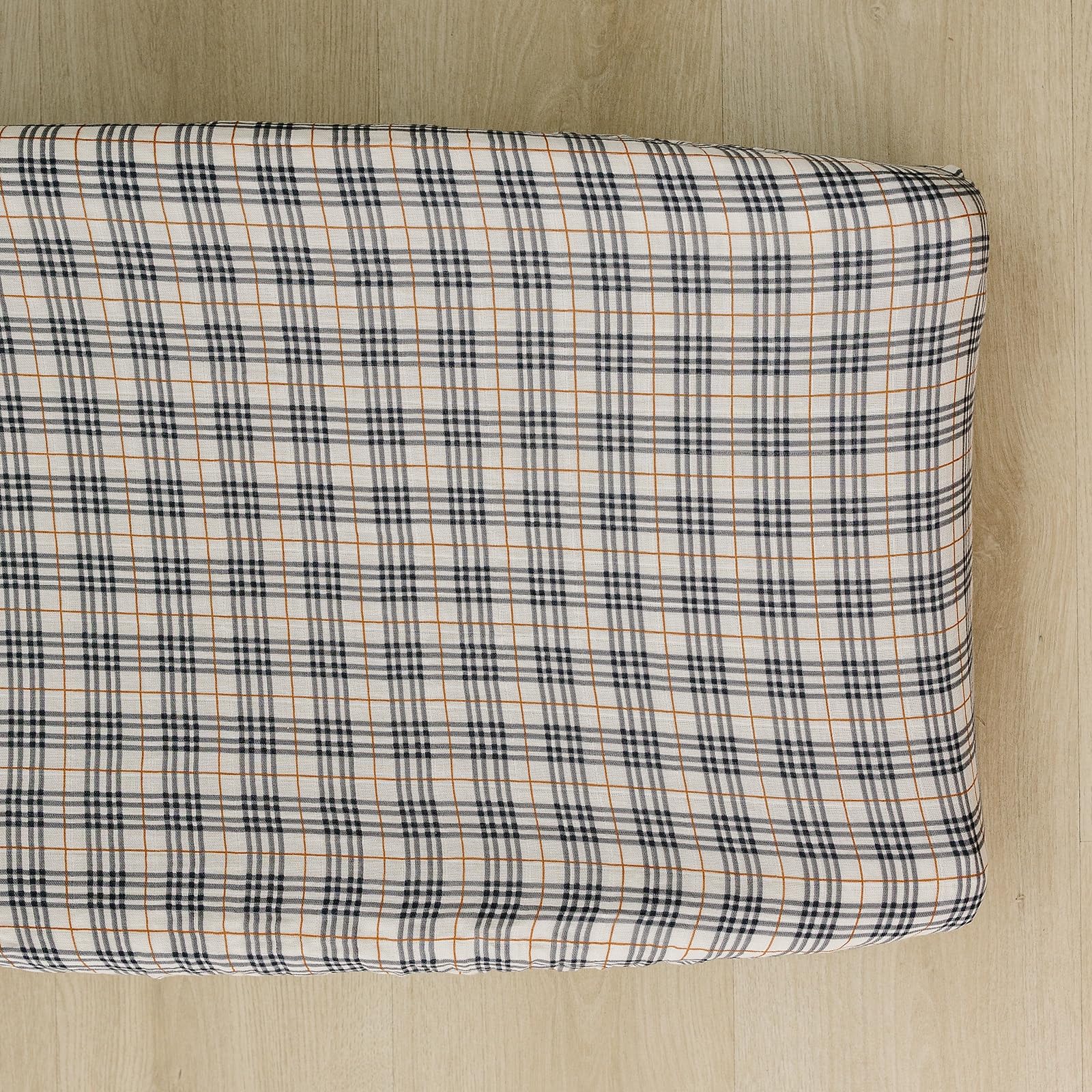 Mebie Baby vintage plaid changing pad cover adds soft, stylish comfort to diaper changes.